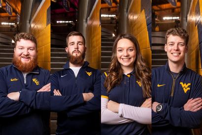 4 students face the camera with their arms crossed. Contenders to be the WVU Mountaineer