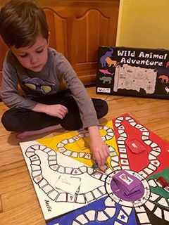 kid playing a boardgame