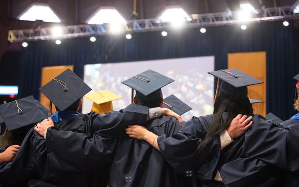 Photo of students singing at graduation
