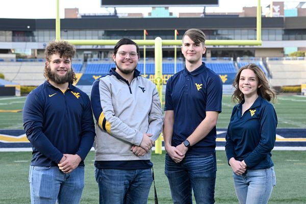 The four finalists competing to be the 69th Mountaineer mascot stand on Mountaineer Field at Milan Puskar Stadium, Feb. 15, 2023. They are (from left to right) Mikel Hager, Christian Adkins, Braden Adkins and Bailey Gatens. (WVU Photo/Brian Persinger)