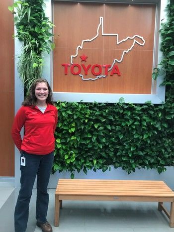 Michaela Luck standing in front of a West Virginia Toyota sign